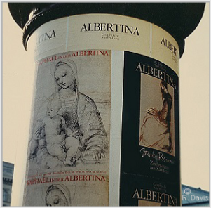 At the entrance to the Albertina, Vienna, the column displaying the posters announcing the museum's exhibitions "Raphael in der Albertina" and "Stanley Roseman - Zeichnungen aus Klostern," 1983. Photo by Ronald Davis.