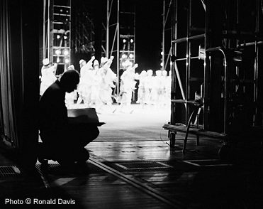 Stanley Roseman drawing from the wings of the stage of the Paris Opra at a performance of "The Rite of Spring," 1994.  Photo Ronald Davis