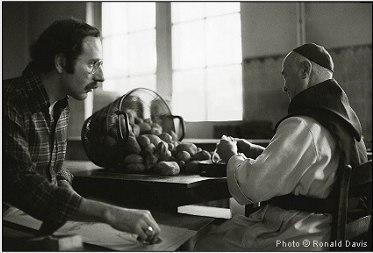 Stanley Roseman drawing a Belgian Trappist monk in the kitchen. Photo by Ronald Davis.